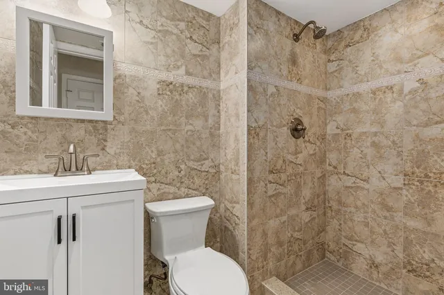 a wooden fence with trees in front of it