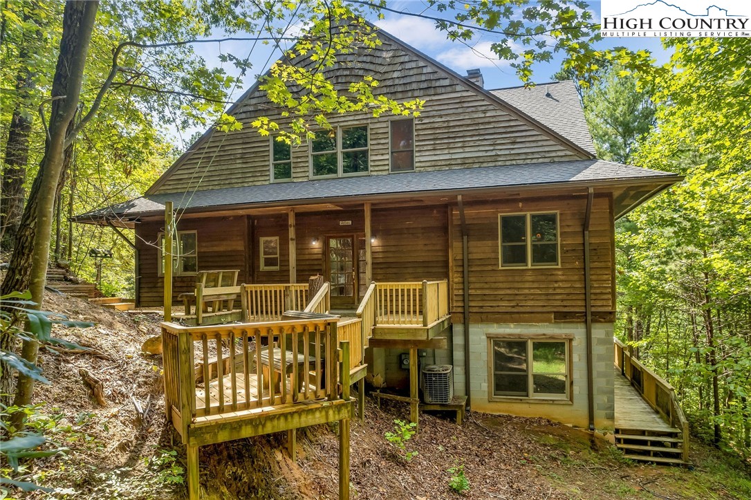 418 Wild Turkey Road Ferguson, NC 28624 - Photo 2 of 50 front view of a house with a porch