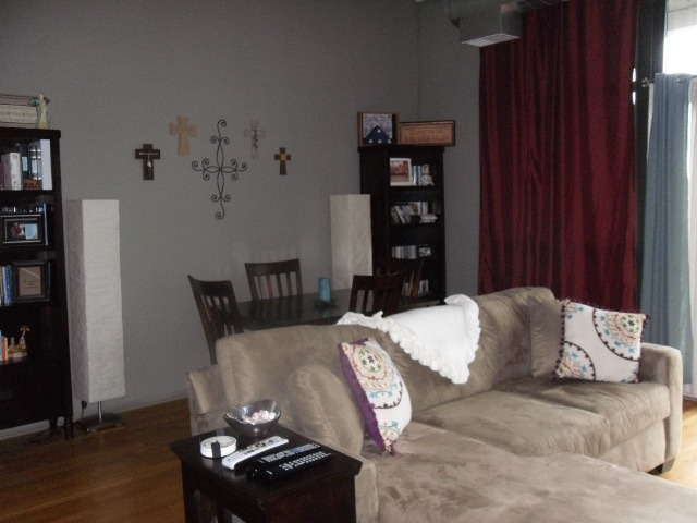 1530 South State Street, Unit 420 Chicago, IL 60605 - Photo 3 of 7 a bedroom with a bed and a couch