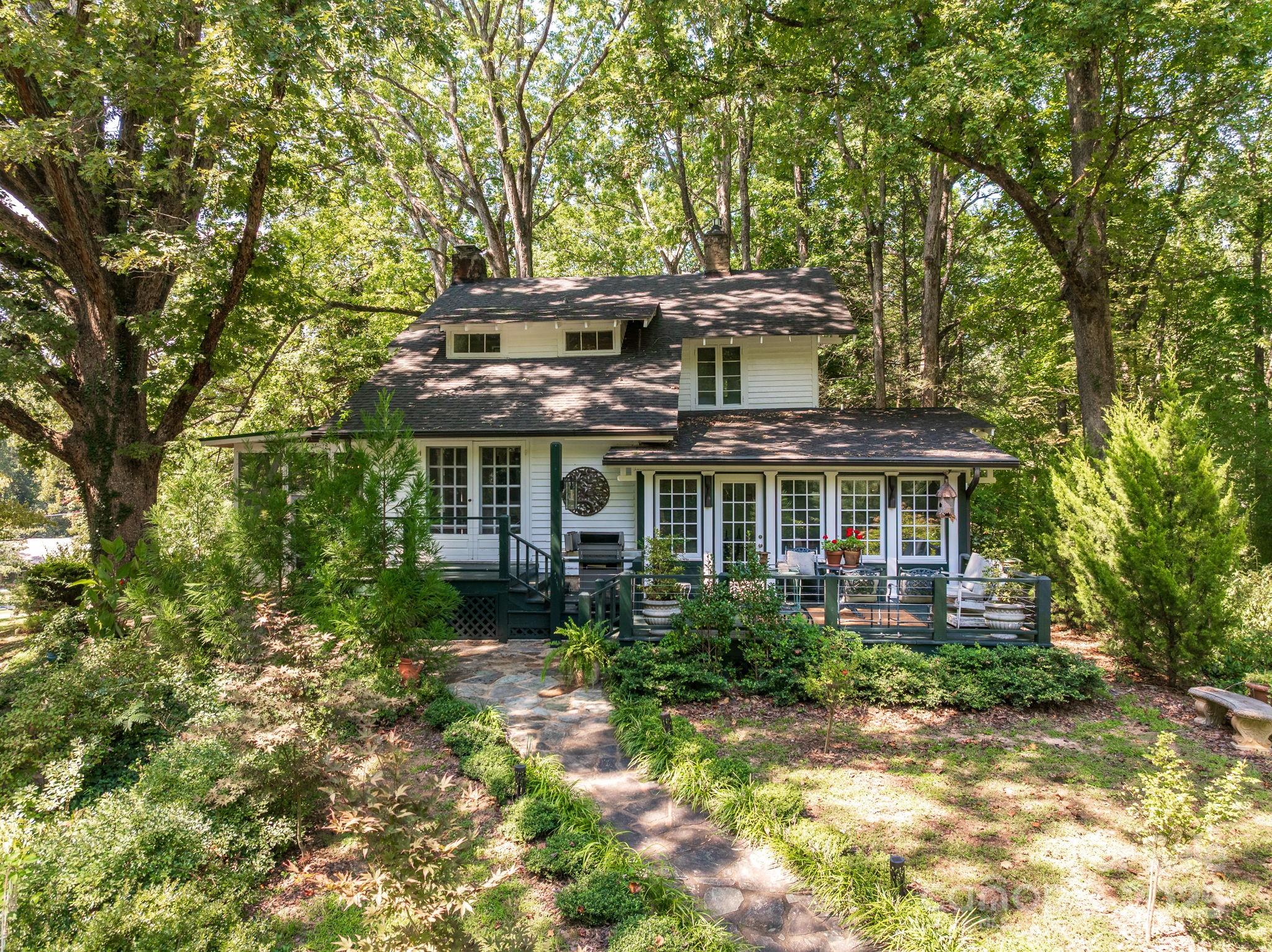 144 Miller Drive Tryon, NC 28782 - Photo 1 of 45 front view of a house with a garden