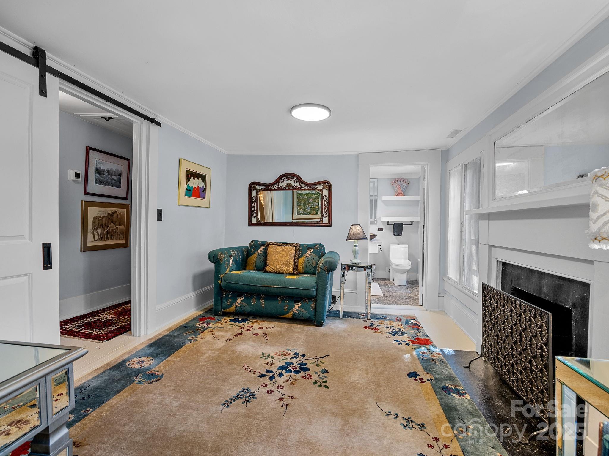 144 Miller Drive Tryon, NC 28782 - Photo 17 of 45 a living room with furniture and a fireplace