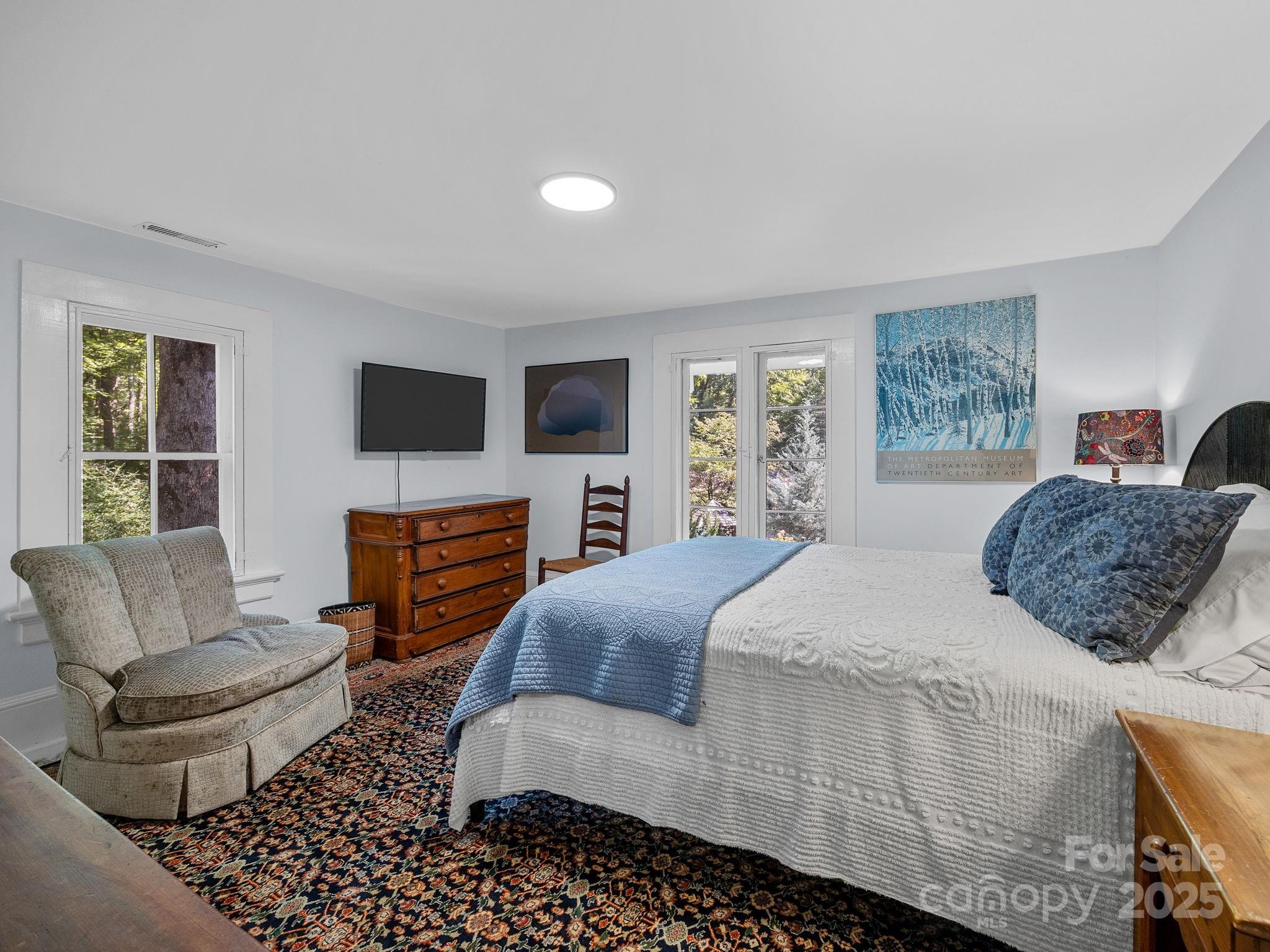 144 Miller Drive Tryon, NC 28782 - Photo 21 of 45 a bedroom with a bed and a couch