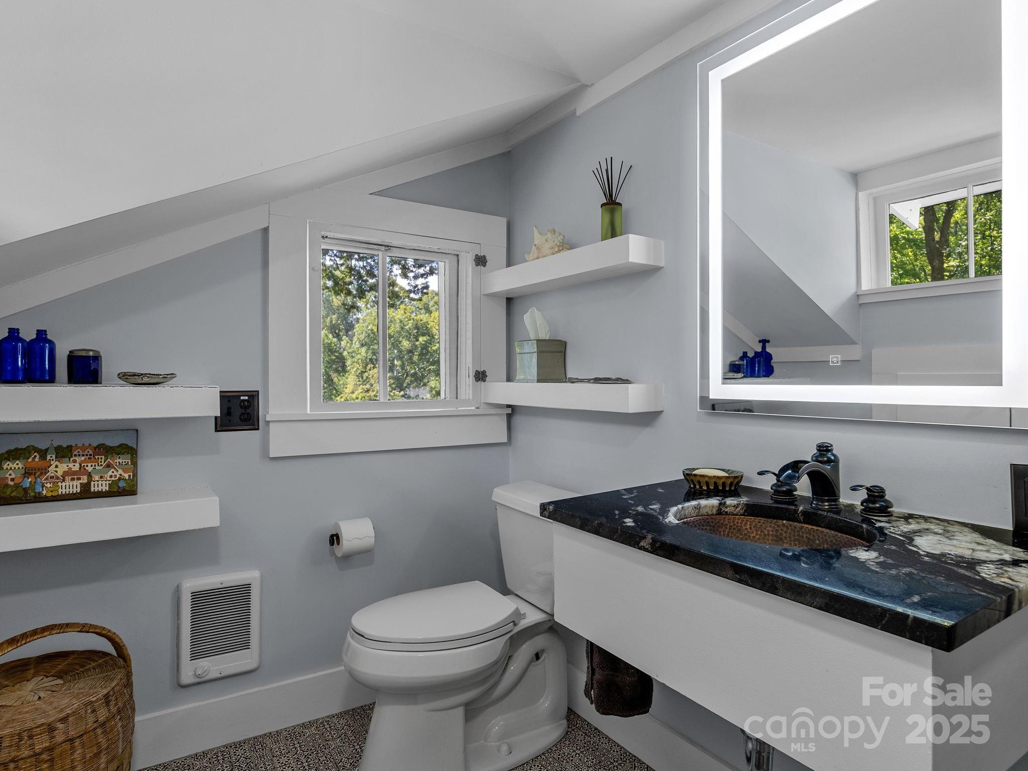 144 Miller Drive Tryon, NC 28782 - Photo 22 of 45 a bathroom with a sink a toilet and a window