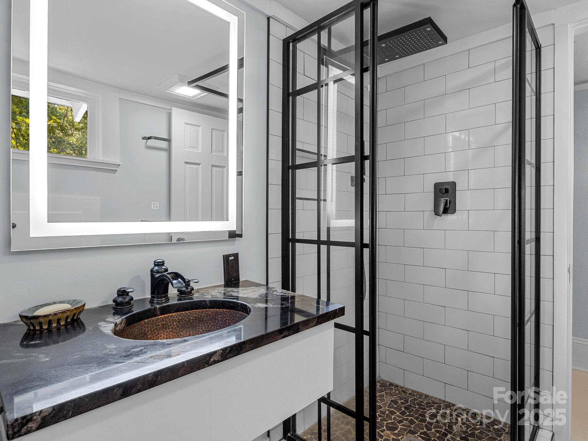 144 Miller Drive Tryon, NC 28782 - Photo 23 of 45 a bathroom with a sink and a mirror