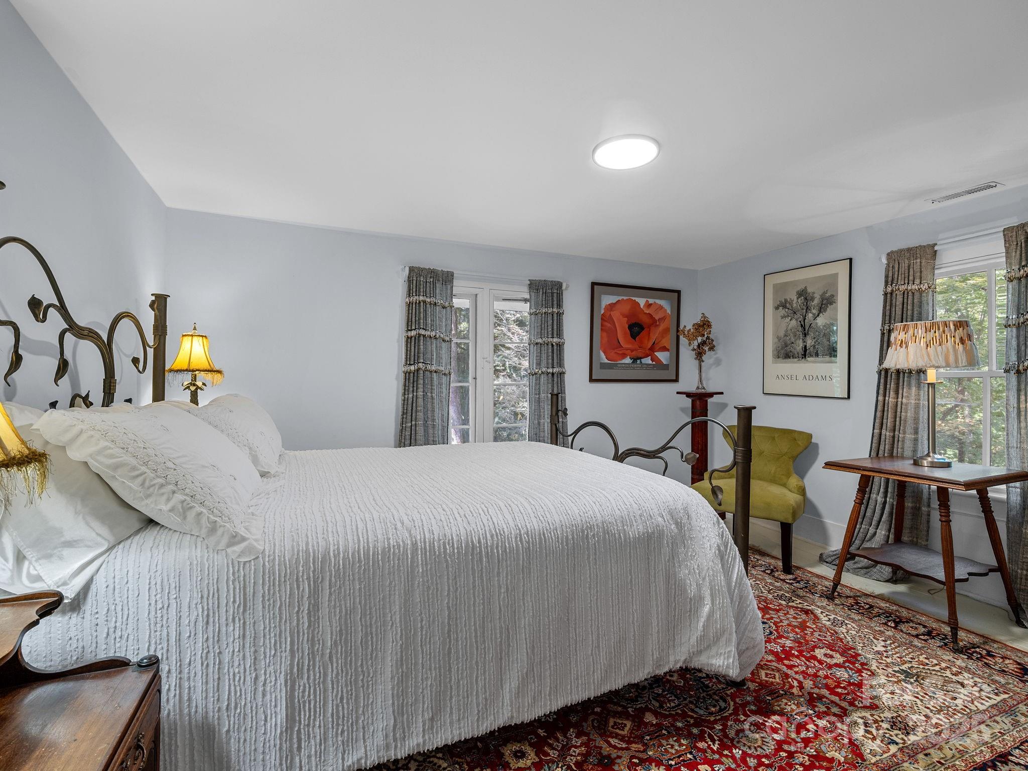 144 Miller Drive Tryon, NC 28782 - Photo 24 of 45 a bedroom with a bed and wooden floor