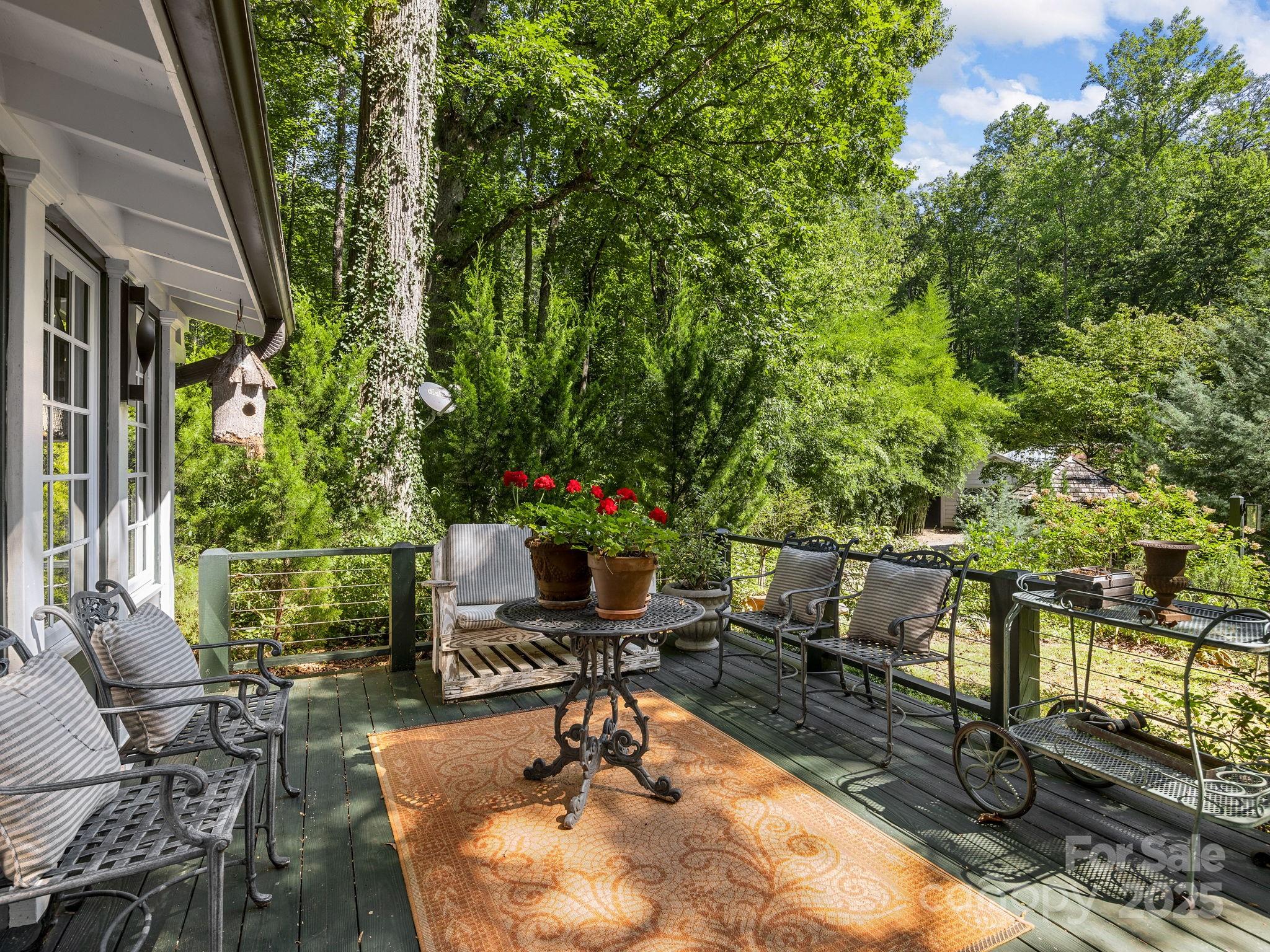 144 Miller Drive Tryon, NC 28782 - Photo 26 of 45 a view of a chairs and table in backyard