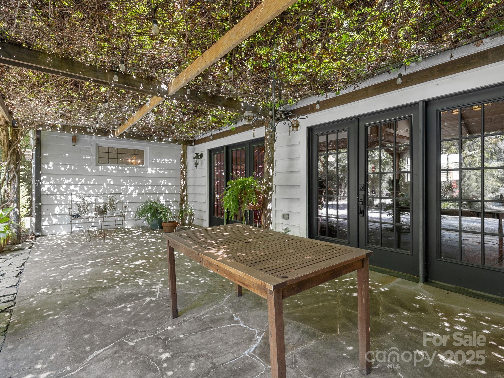 144 Miller Drive Tryon, NC 28782 - Photo 30 of 45 a view of house with backyard and outdoor seating