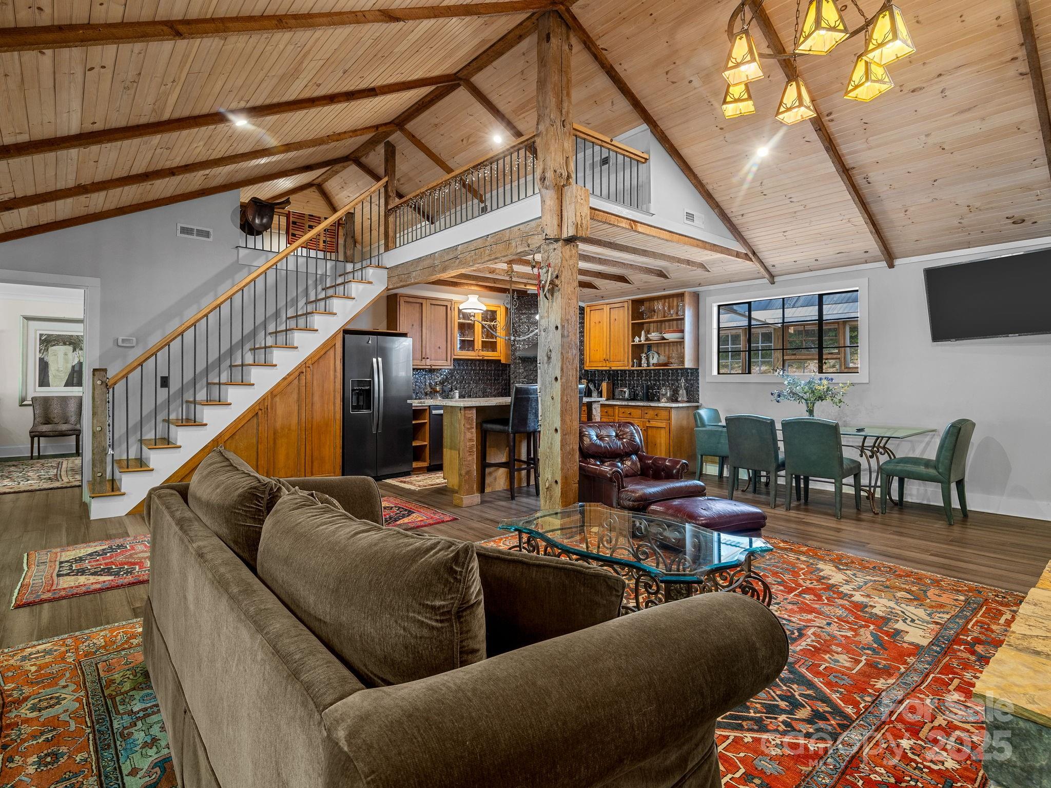 144 Miller Drive Tryon, NC 28782 - Photo 32 of 45 a living room with furniture and a flat screen tv