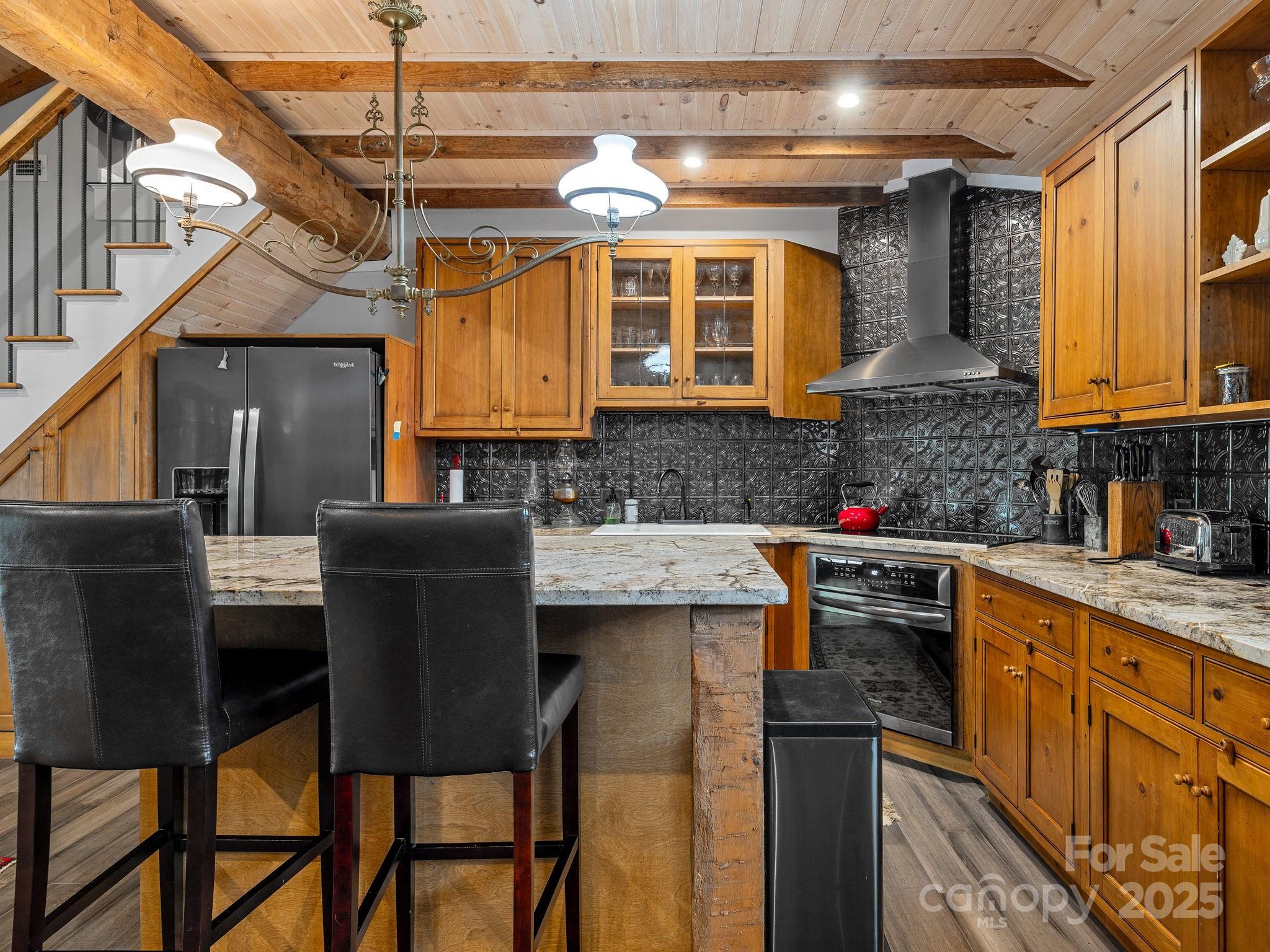 144 Miller Drive Tryon, NC 28782 - Photo 33 of 45 a kitchen that has a cabinets and a table in it
