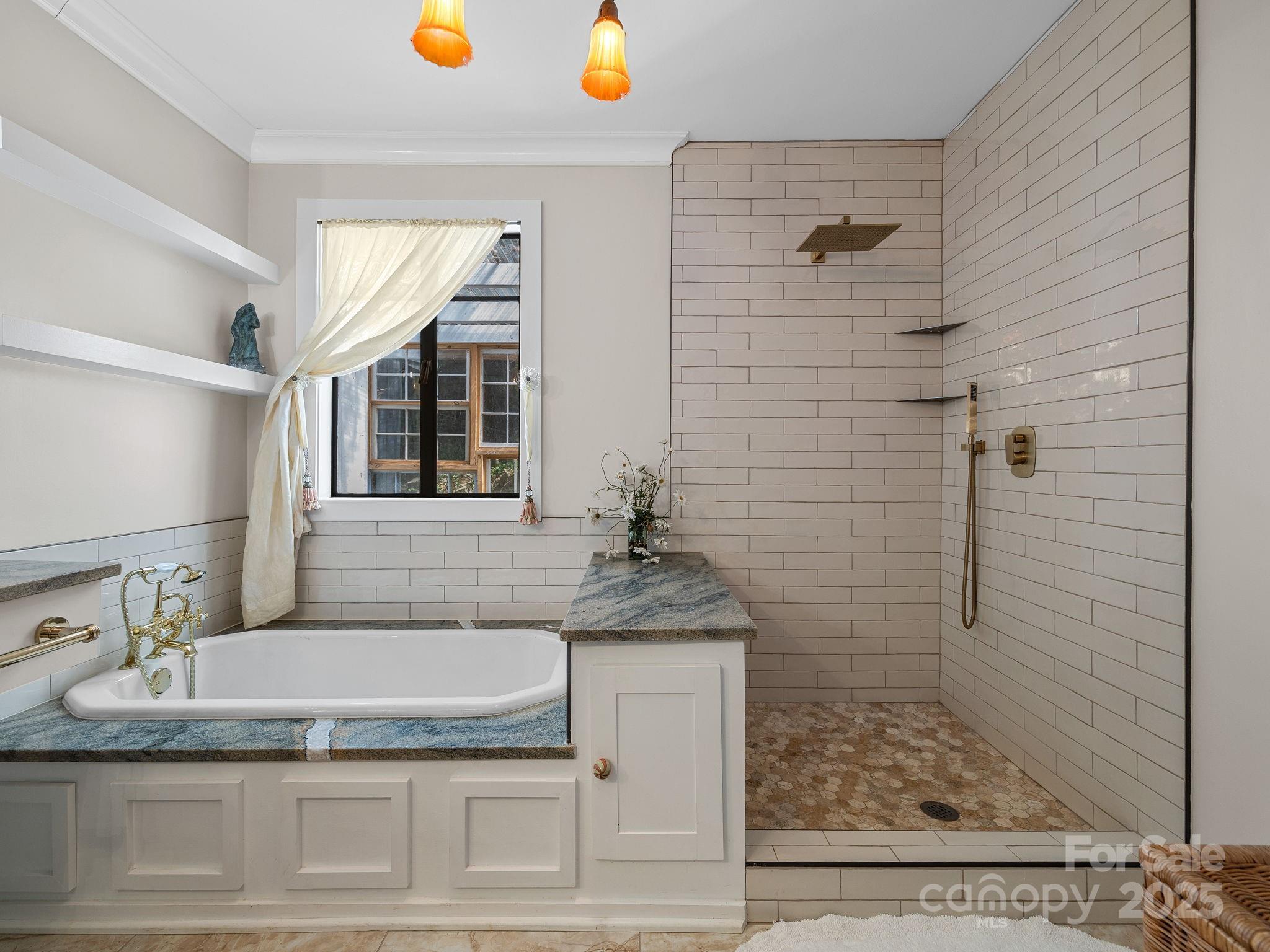 144 Miller Drive Tryon, NC 28782 - Photo 38 of 45 a bathroom with a granite countertop sink a mirror and shower