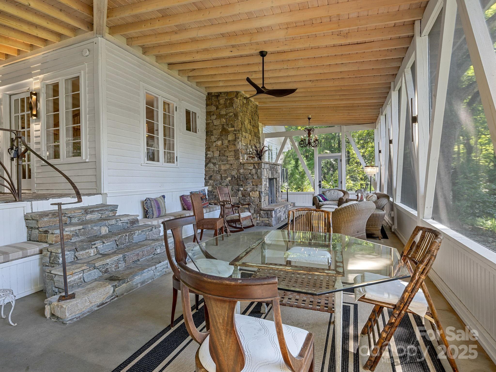 144 Miller Drive Tryon, NC 28782 - Photo 5 of 45 a view of an outdoor dining space with a table and chairs