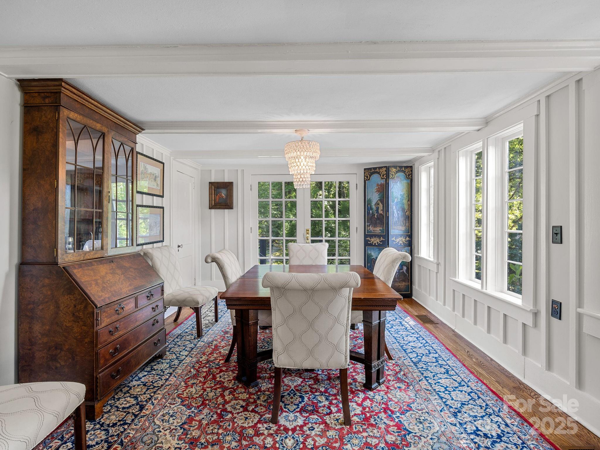 144 Miller Drive Tryon, NC 28782 - Photo 10 of 45 a view of a dining room with furniture window and wooden floor