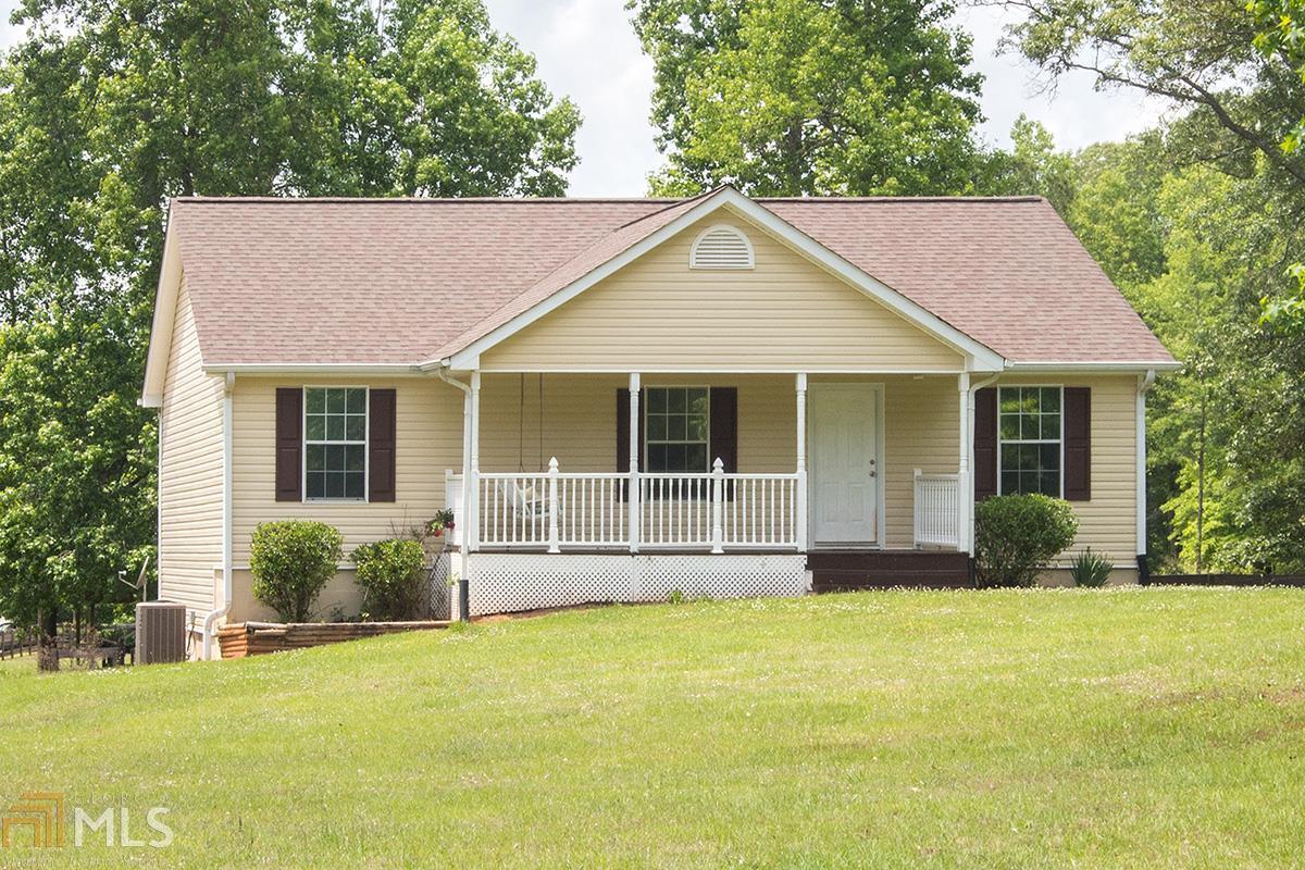 3530 Old Mill Road Rutledge, GA 30663 - Photo 1 of 1 a front view of a house with a garden