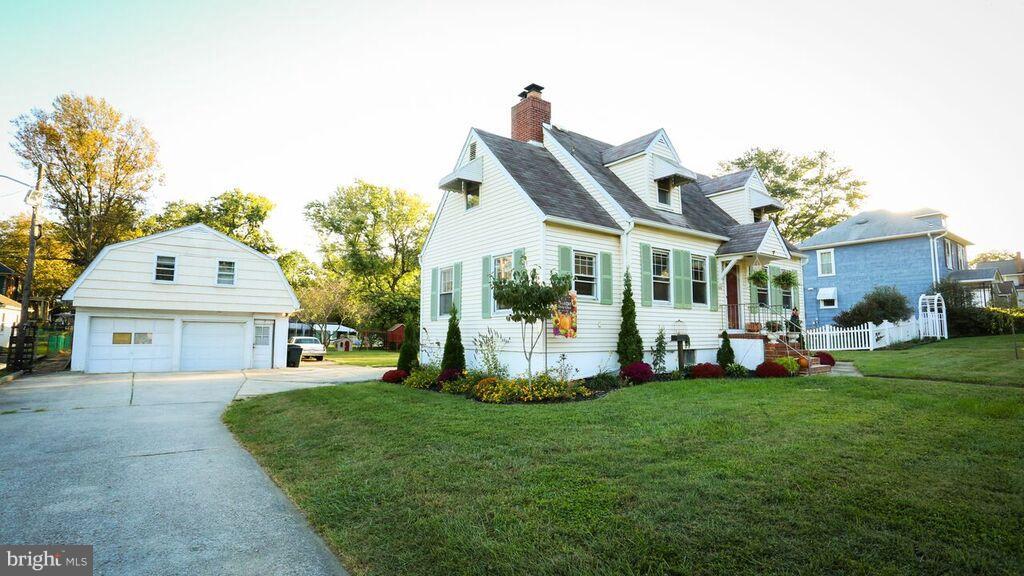 415 Greenwood Road Linthicum, MD 21090 - Photo 2 of 22 a front view of a house with a yard and porch