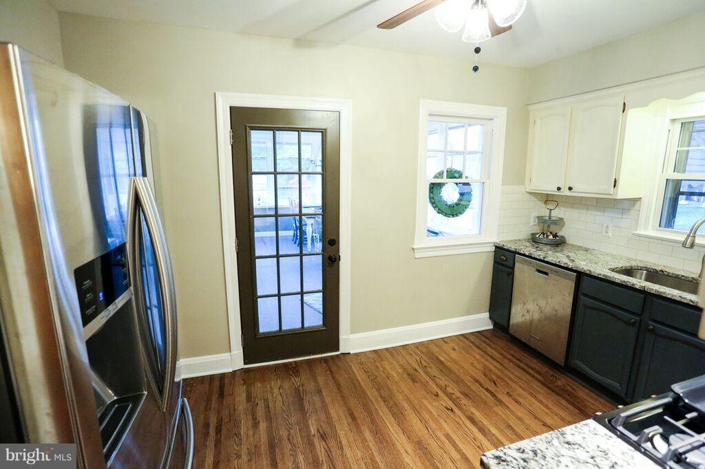 415 Greenwood Road Linthicum, MD 21090 - Photo 12 of 22 a kitchen with stainless steel appliances granite countertop a refrigerator and a sink