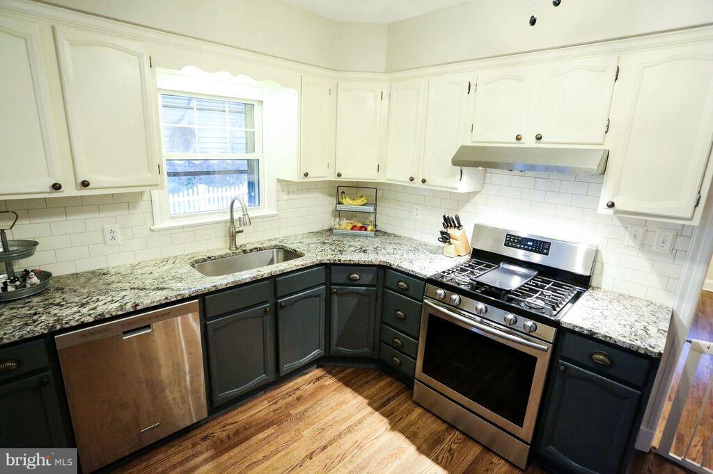 415 Greenwood Road Linthicum, MD 21090 - Photo 13 of 22 a kitchen with a sink stove and cabinets