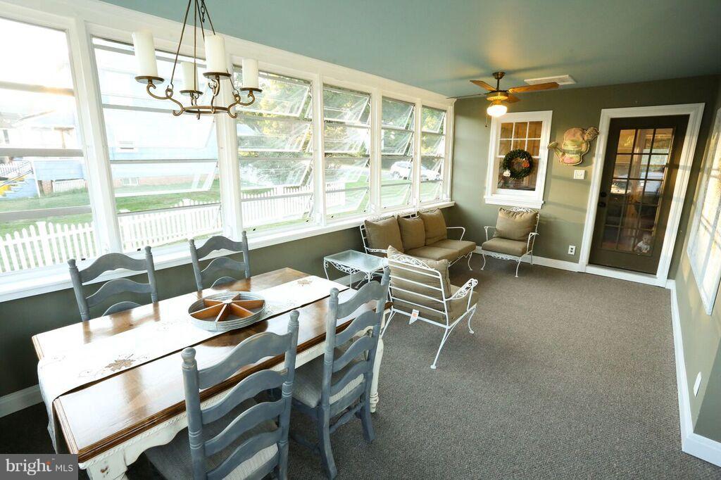 415 Greenwood Road Linthicum, MD 21090 - Photo 14 of 22 a dining room with furniture and large windows