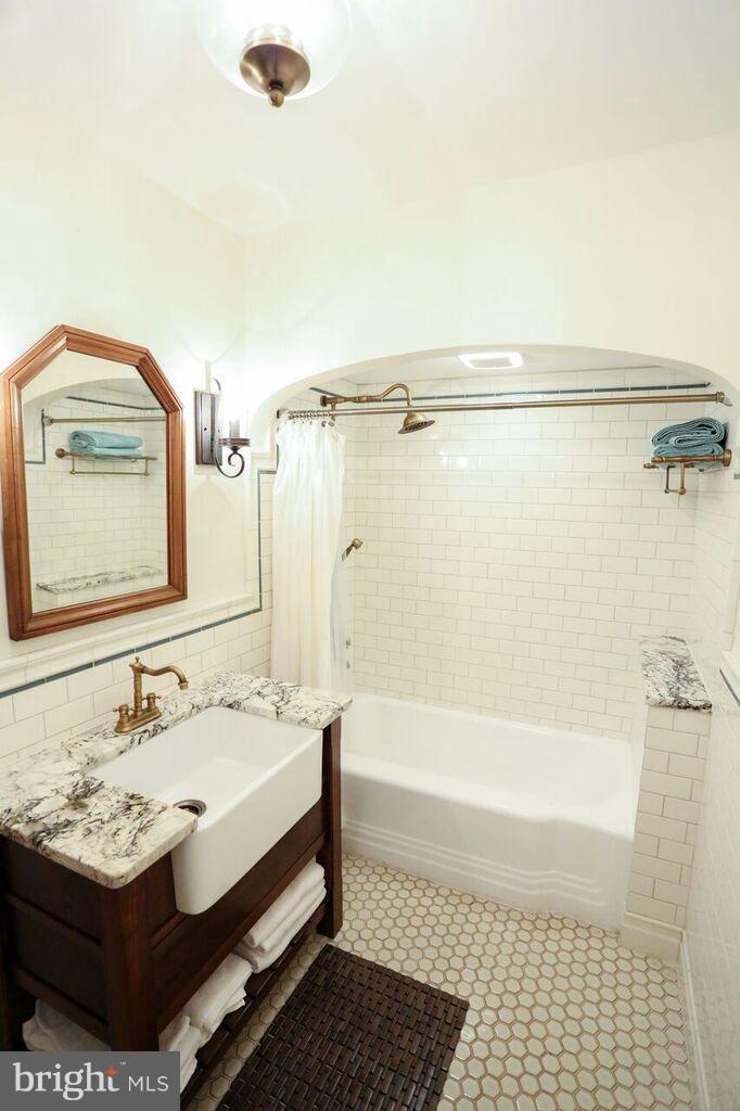 415 Greenwood Road Linthicum, MD 21090 - Photo 15 of 22 a bathroom with a sink and a mirror