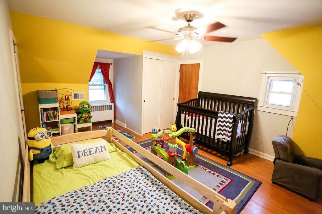 415 Greenwood Road Linthicum, MD 21090 - Photo 17 of 22 a bedroom with furniture and a window
