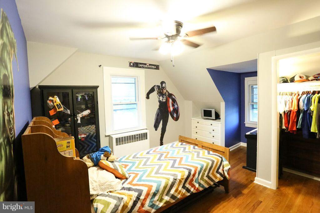 415 Greenwood Road Linthicum, MD 21090 - Photo 18 of 22 a bed room with a bed and a walk in closet