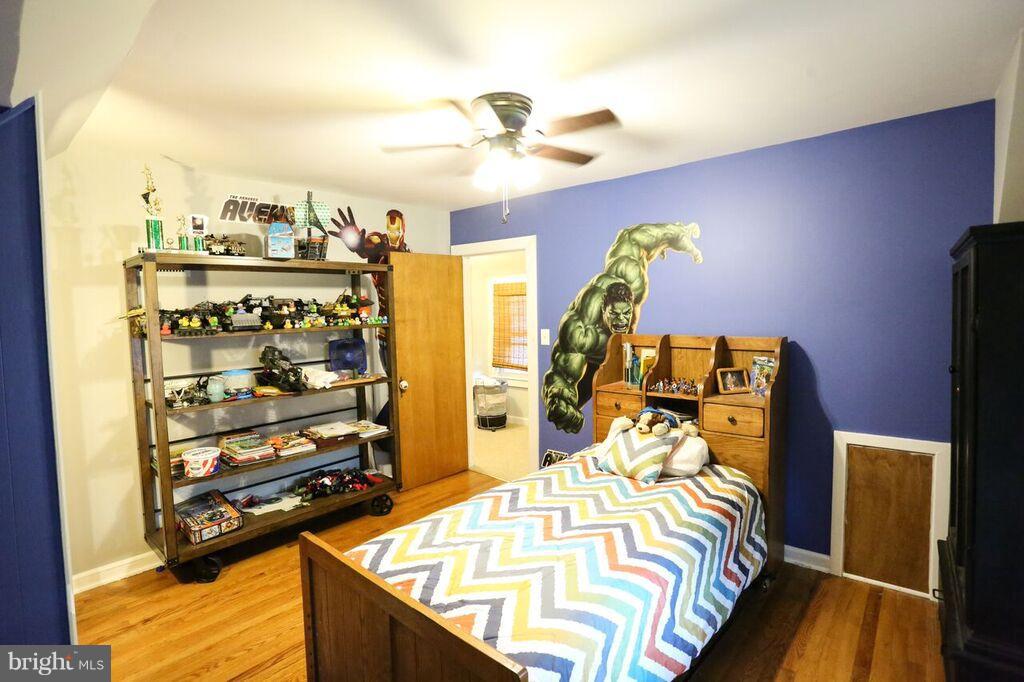 415 Greenwood Road Linthicum, MD 21090 - Photo 19 of 22 a bed sitting in a bedroom next to a window with pc on the table