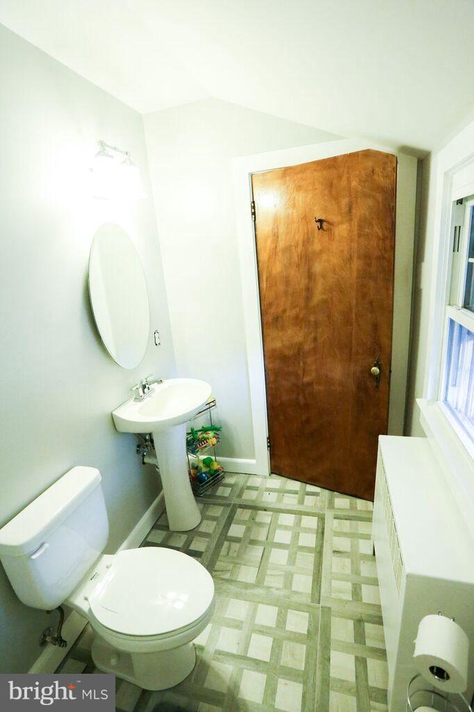 415 Greenwood Road Linthicum, MD 21090 - Photo 21 of 22 a bathroom with a sink toilet and shower