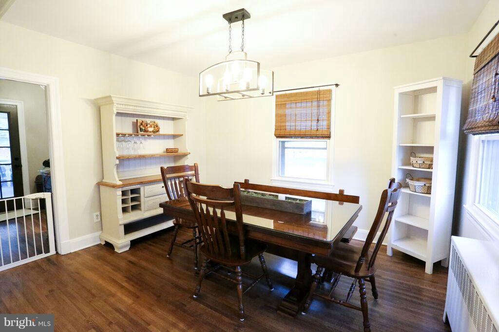 415 Greenwood Road Linthicum, MD 21090 - Photo 8 of 22 a view of a dining room with furniture window and wooden floor
