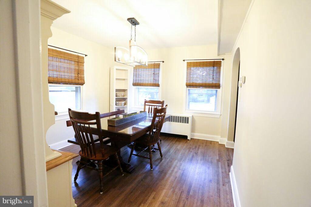 415 Greenwood Road Linthicum, MD 21090 - Photo 9 of 22 a view of a dining room with furniture and wooden floor