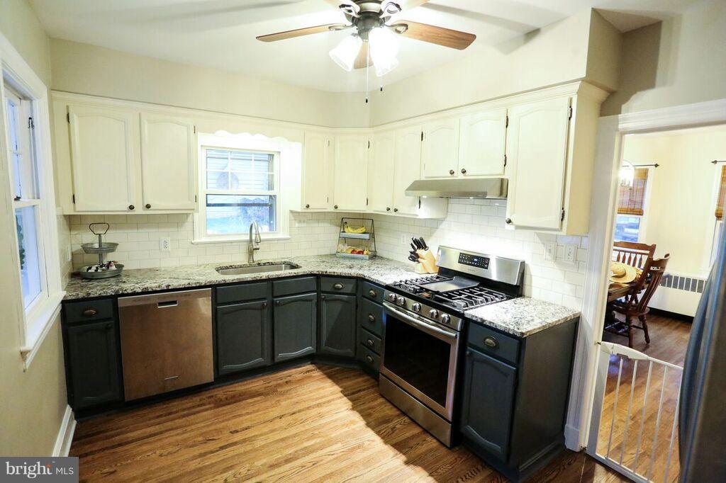415 Greenwood Road Linthicum, MD 21090 - Photo 10 of 22 a kitchen with stainless steel appliances granite countertop a stove sink and cabinets