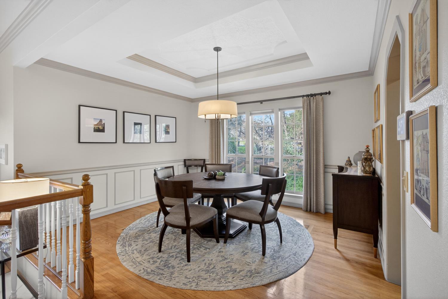 8681 Winding Way Fair Oaks, CA 95628 - Photo 18 of 87 a dining room with furniture a chandelier and wooden floor