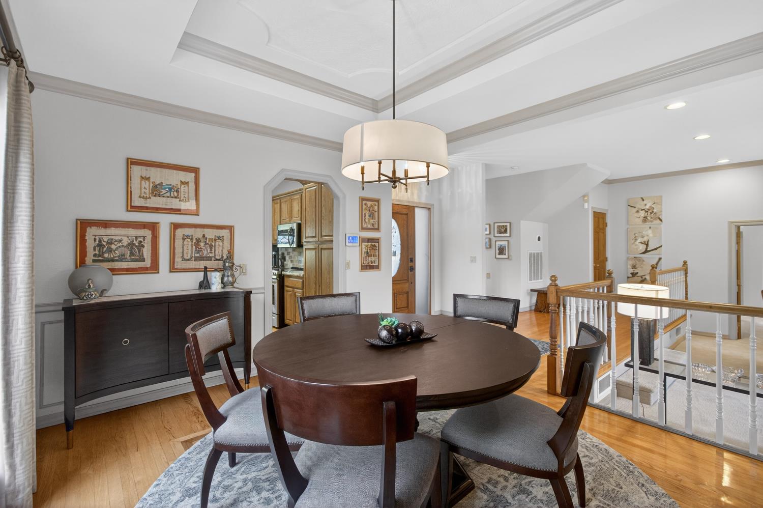 8681 Winding Way Fair Oaks, CA 95628 - Photo 19 of 87 a dining room with furniture a rug and a chandelier