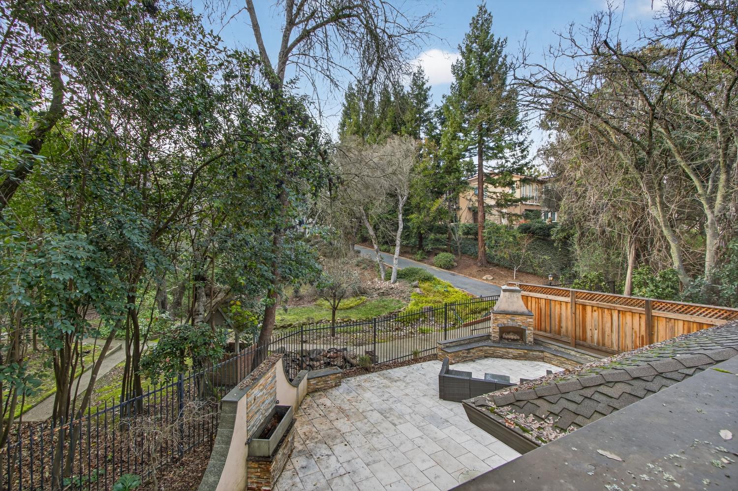 8681 Winding Way Fair Oaks, CA 95628 - Photo 2 of 87 a view of a backyard with plants and a bench