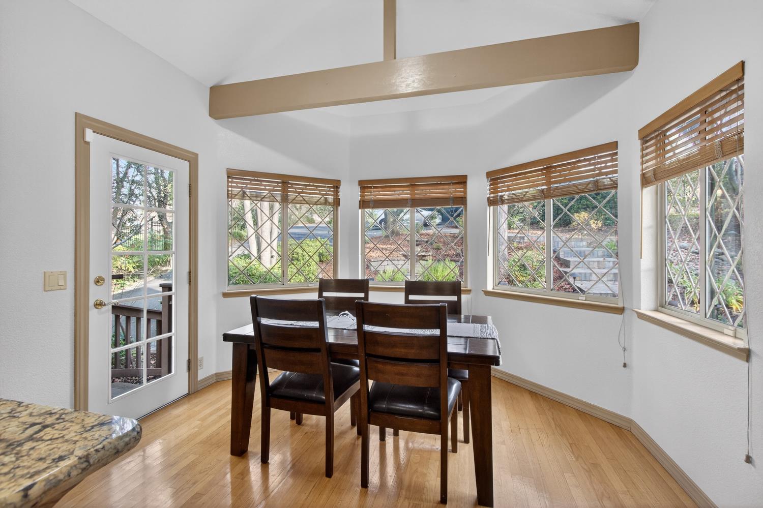 8681 Winding Way Fair Oaks, CA 95628 - Photo 27 of 87 a view of a dining room with furniture windows and wooden floor