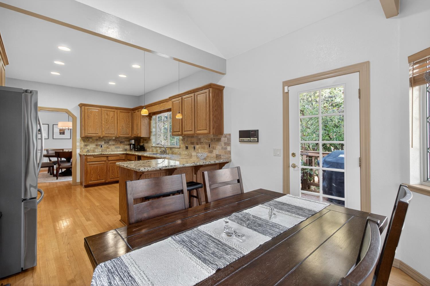 8681 Winding Way Fair Oaks, CA 95628 - Photo 28 of 87 a living room with stainless steel appliances furniture a rug and a kitchen view