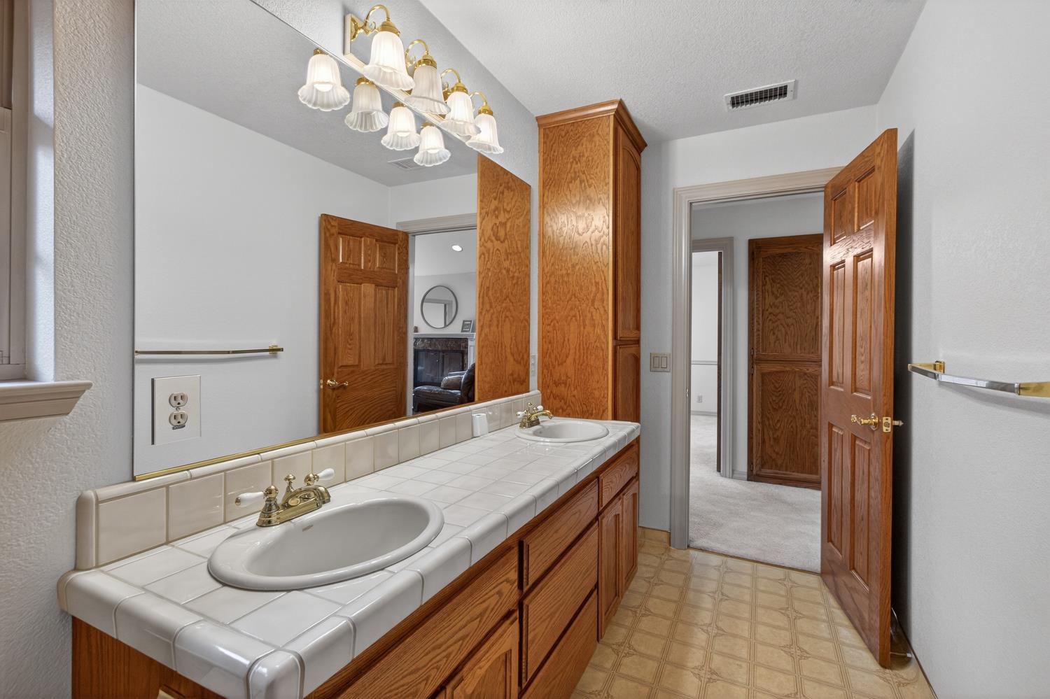 8681 Winding Way Fair Oaks, CA 95628 - Photo 60 of 87 a bathroom with a sink double vanity and a mirror
