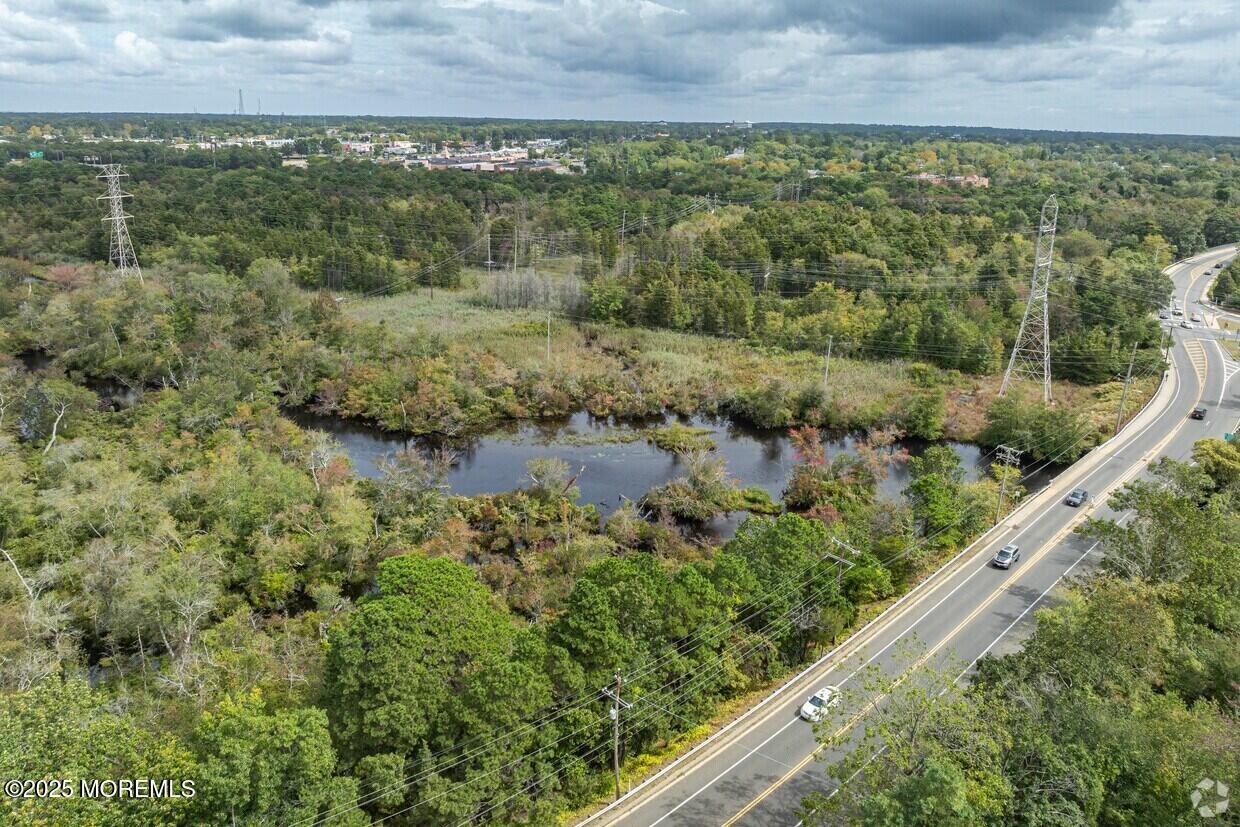 354 Lakehurst Road Toms River, NJ 08755 - Photo 16 of 28 an aerial view of residential houses with outdoor space and trees