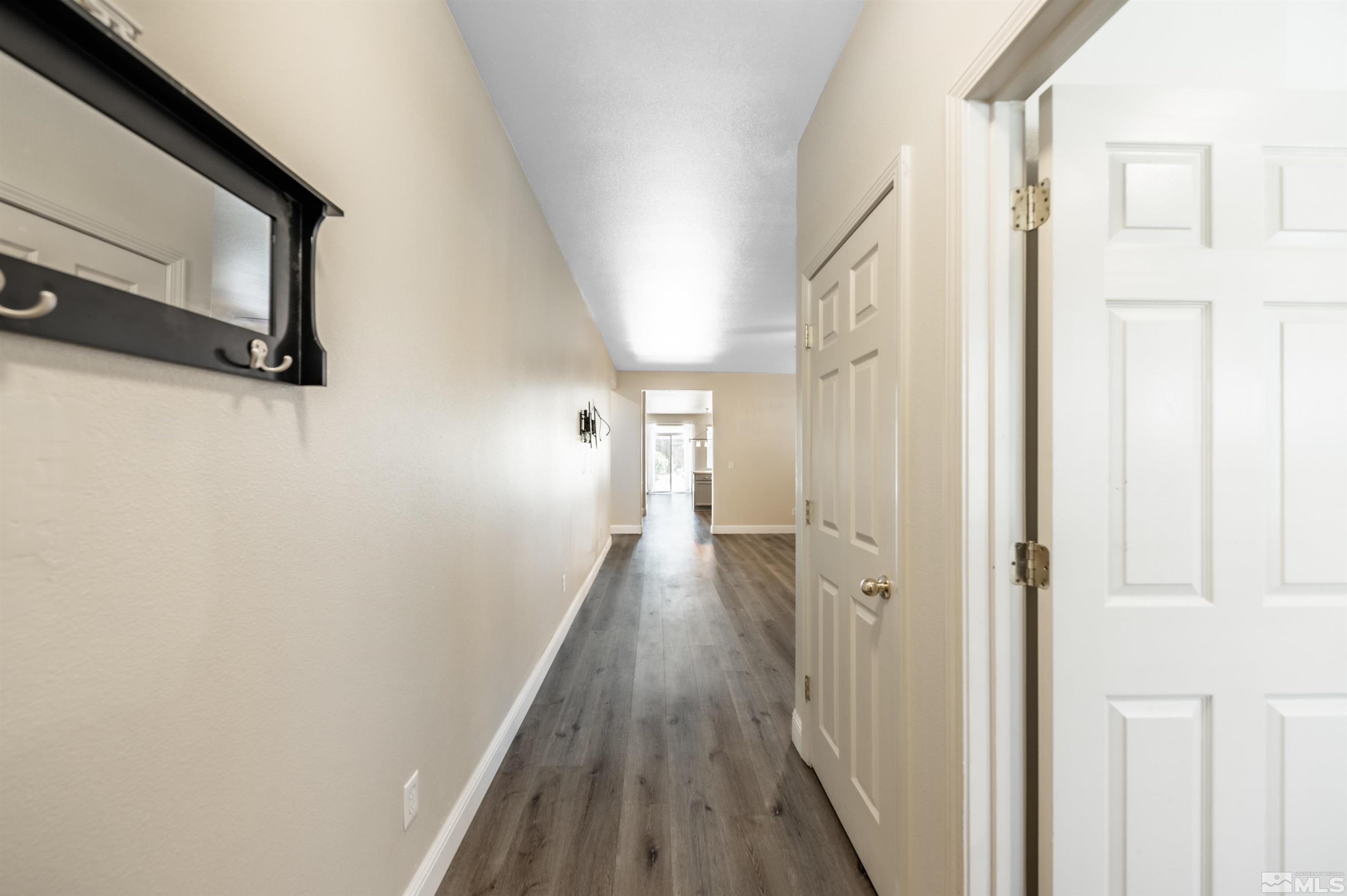 2260 Big Trail Circle Reno, NV 89521 - Photo 4 of 29 a view of a hallway with wooden floor and staircase