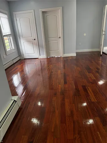 a view of entryway with wooden floor