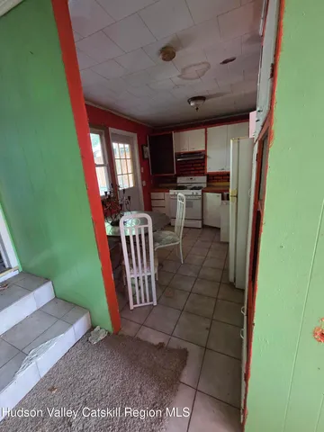 a view of kitchen with furniture and a fireplace