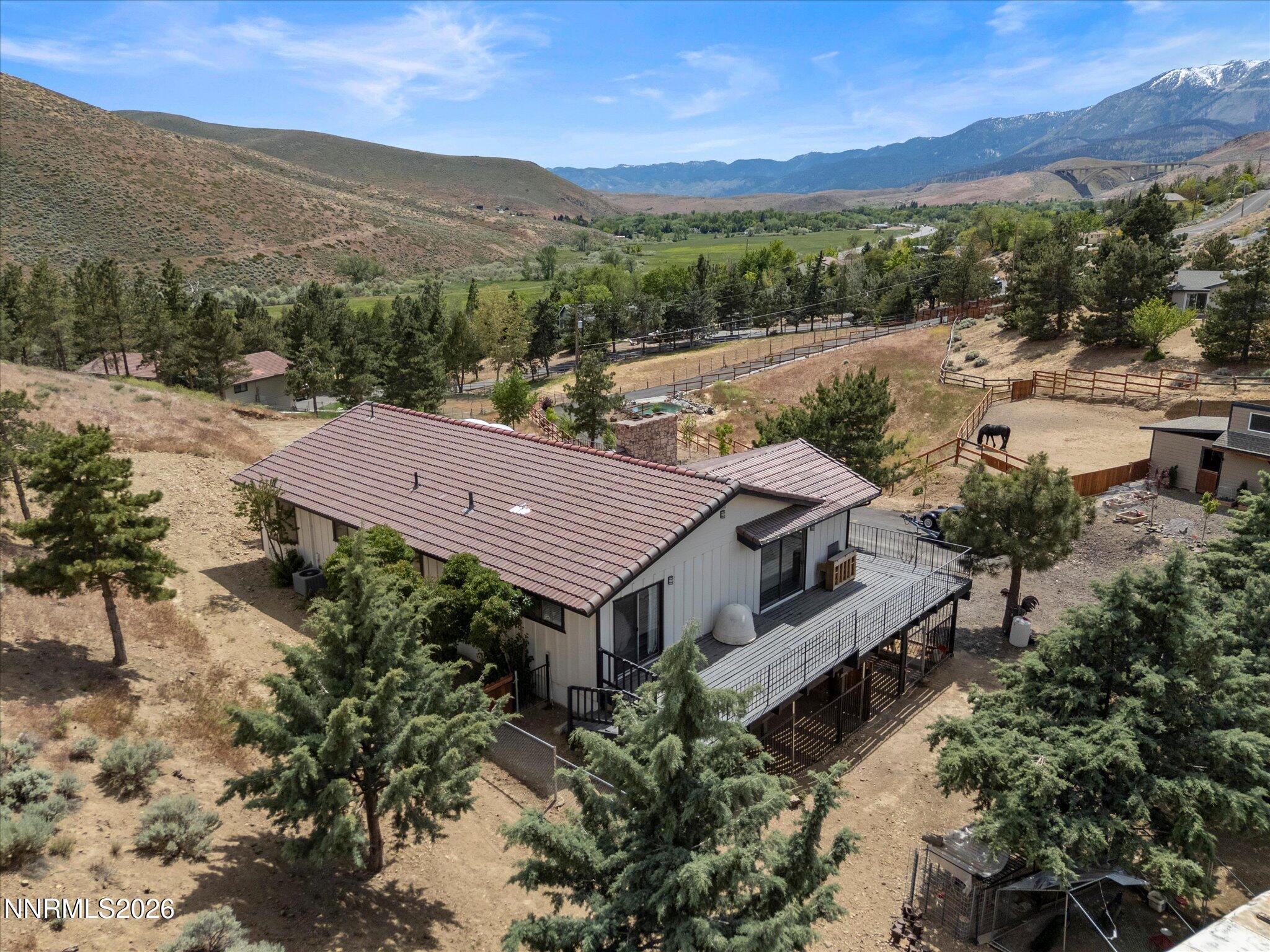 20449 Temelec Way Reno, NV 89521 - Photo 49 of 65 a view of a house with a mountain yard