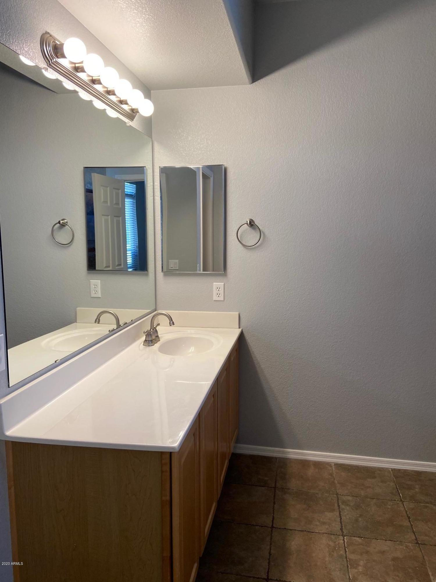 16825 North 14th Street, Unit 45 Phoenix, AZ 85022 - Photo 17 of 35 a bathroom with a sink and a mirror