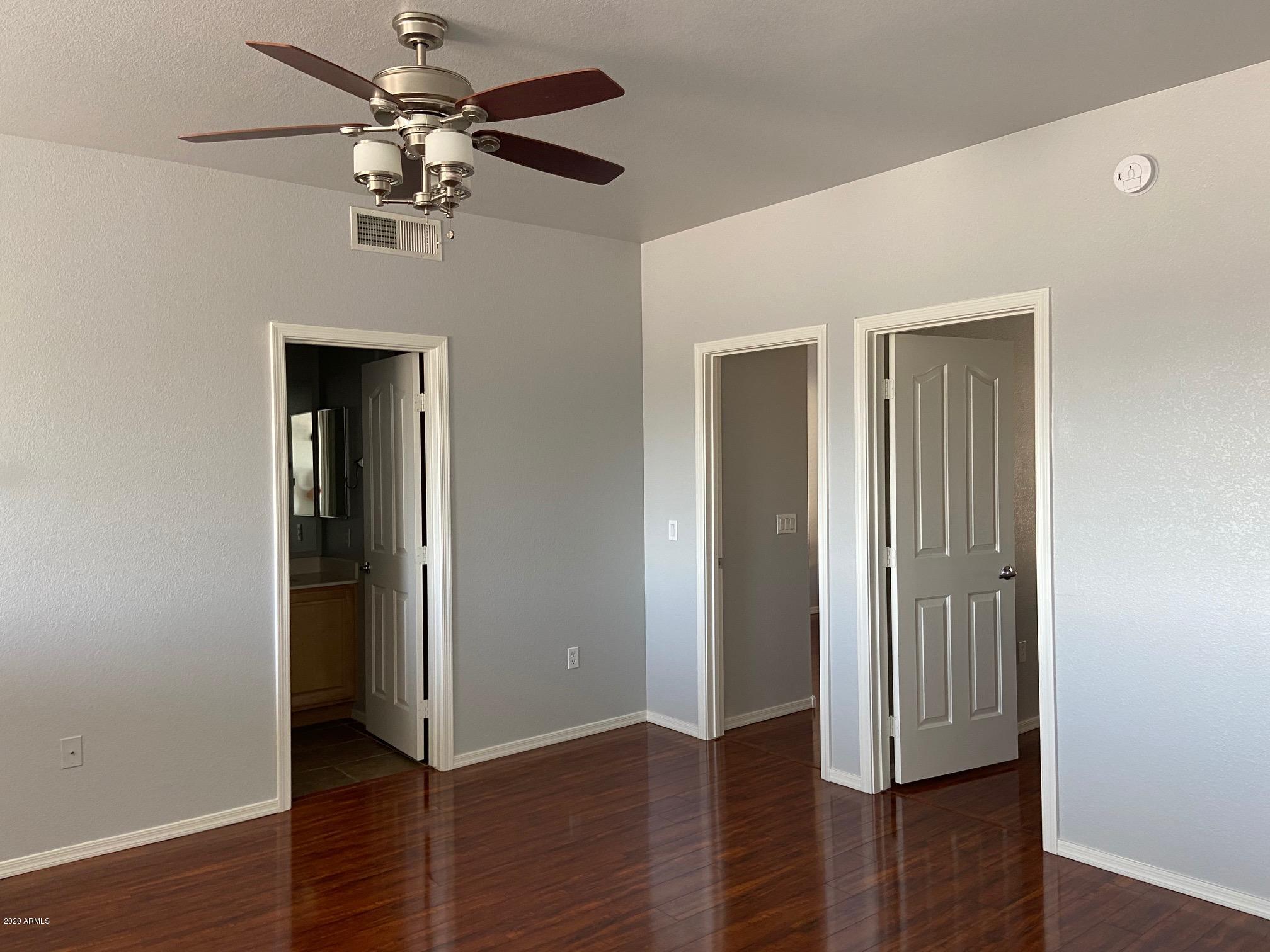 16825 North 14th Street, Unit 45 Phoenix, AZ 85022 - Photo 22 of 35 a view of a hallway with wooden floor