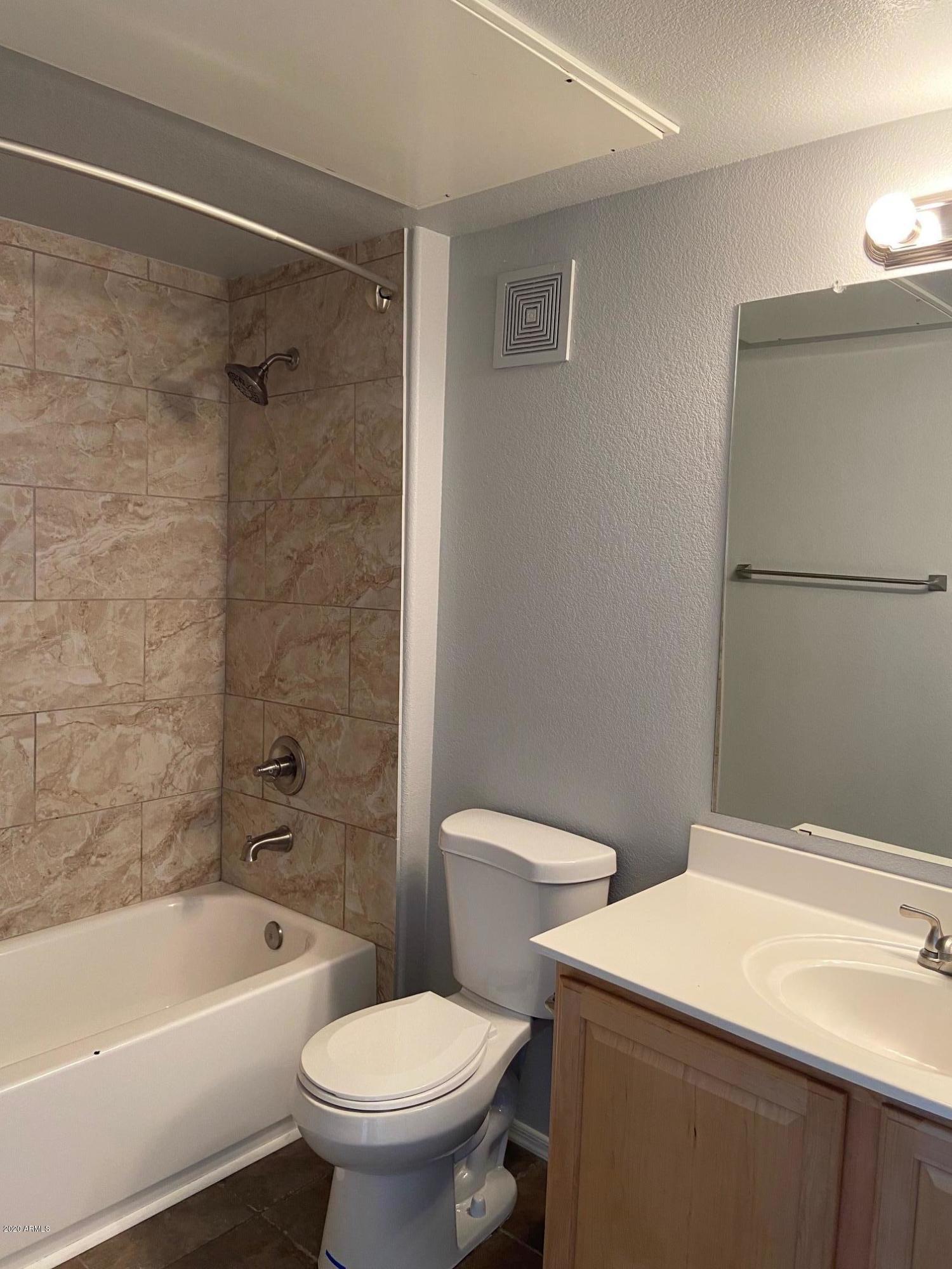 16825 North 14th Street, Unit 45 Phoenix, AZ 85022 - Photo 25 of 35 a bathroom with a sink a toilet and a bathtub