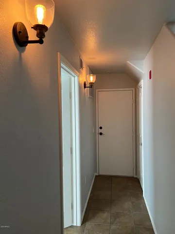 a view of a pathway both side of the house