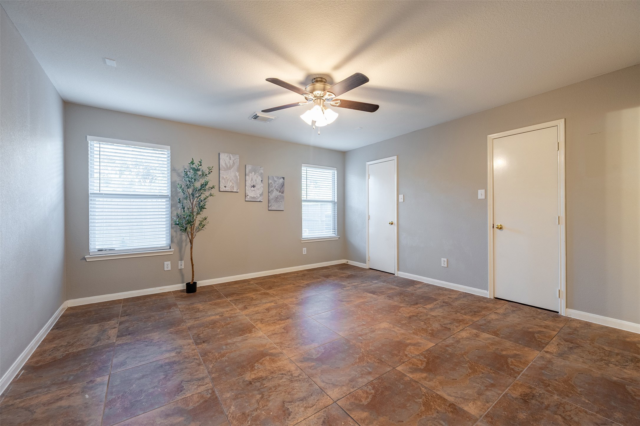 15823 Kings Cypress Lane Cypress, TX 77429 - Photo 16 of 33 Bright and airy Primary Bedroom with great natural light and a pleasant view of the private backyard. Dual closet doors offer ample storage space.
