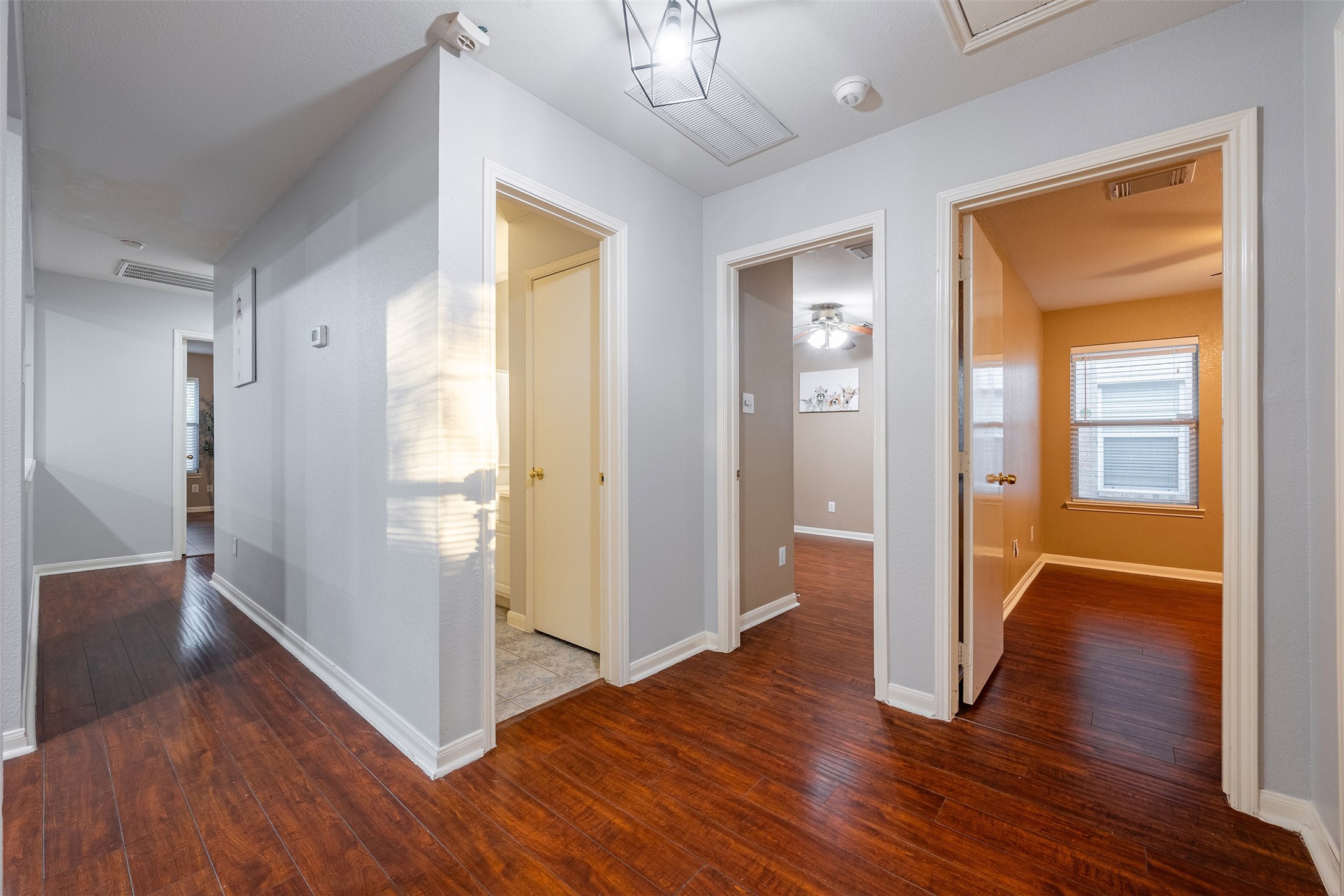 15823 Kings Cypress Lane Cypress, TX 77429 - Photo 20 of 33 This private corridor leads to all bedrooms, offering peace and quiet away from the kitchen and family room.