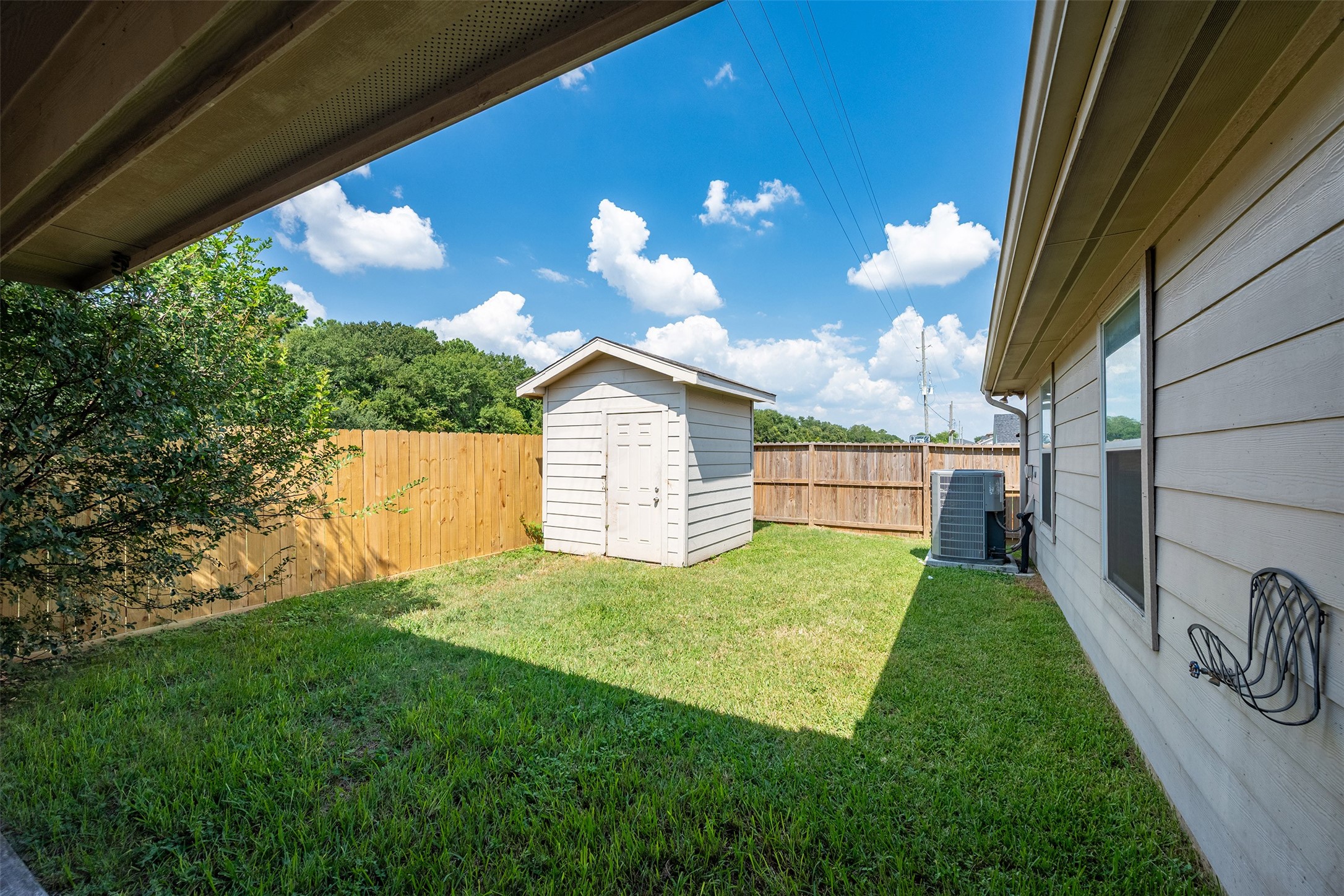 15823 Kings Cypress Lane Cypress, TX 77429 - Photo 29 of 33 Extra storage is easy! Included backyard storage shed helps keep your garage clutter-free.