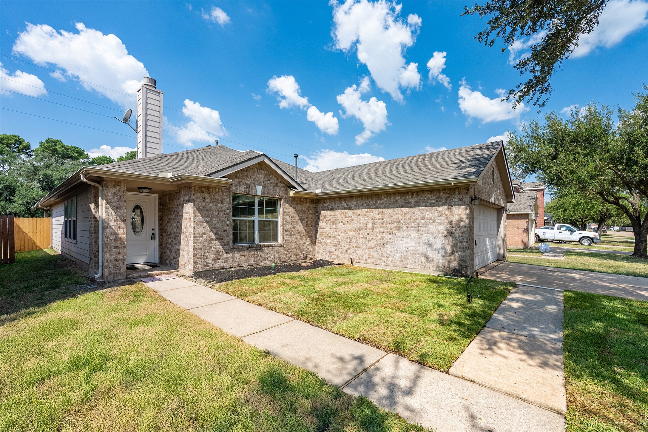 15823 Kings Cypress Lane Cypress, TX 77429 - Photo 3 of 33 Covered front entrance and a double-wide driveway provide ample parking and convenience. New roof installed in July 2025, and new front door in Sep 2025.
