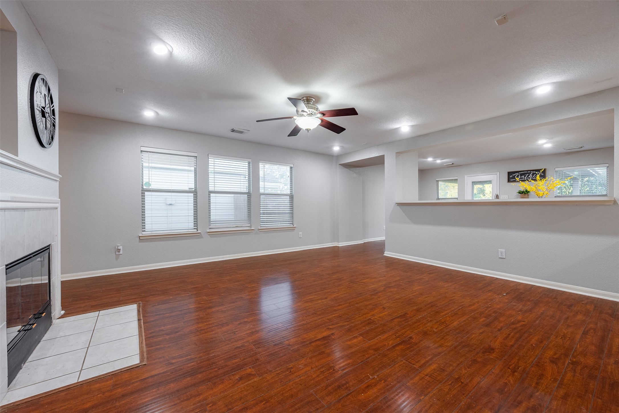15823 Kings Cypress Lane Cypress, TX 77429 - Photo 8 of 33 Enjoy the low-maintenance, wood laminate flooring that flows seamlessly through the main living areas.