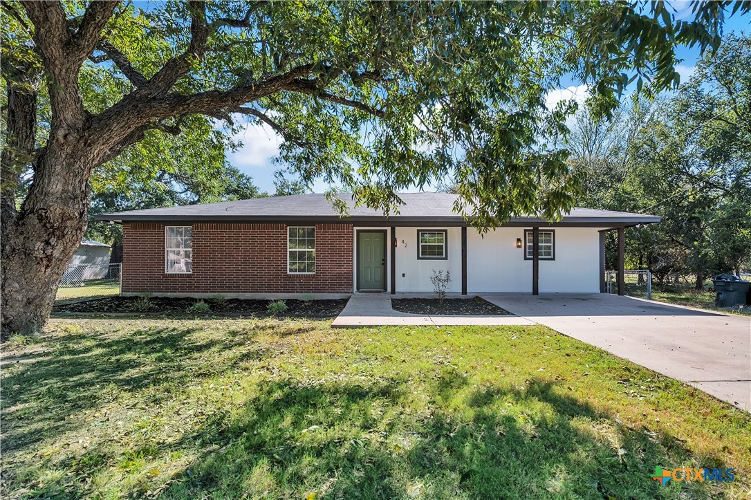 front view of a house with a yard